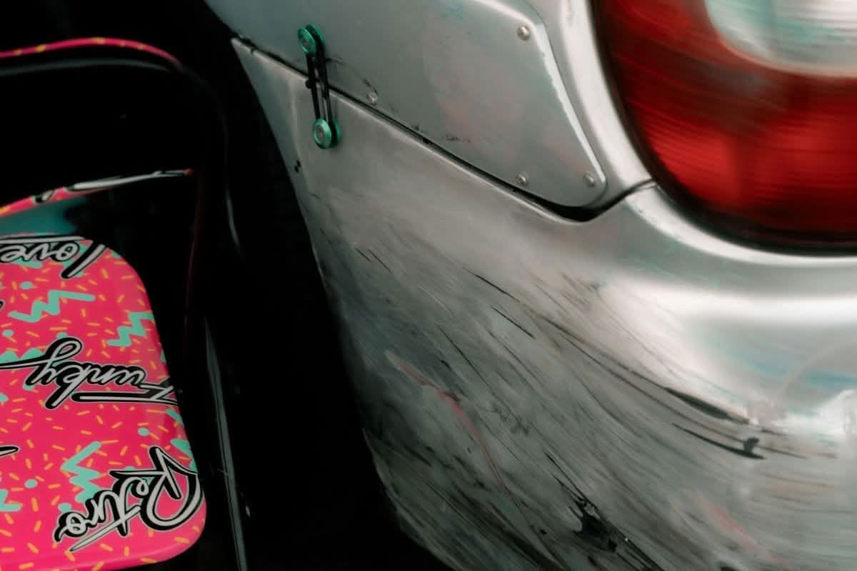 Scuffed and scratched car bumper showing cosmetic paint damage