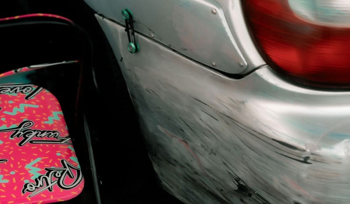 Scuffed and scratched car bumper showing cosmetic paint damage